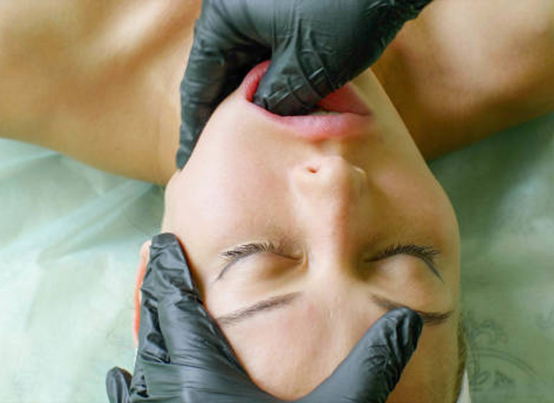 IASTM treatment, gloved hands-on technique extending the reach of manual therapy.